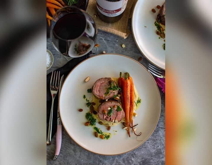 Marinated Shoulder Of Lamb Hummus Plumped Raisins Almonds Honey Roasted Carrots Gremolata